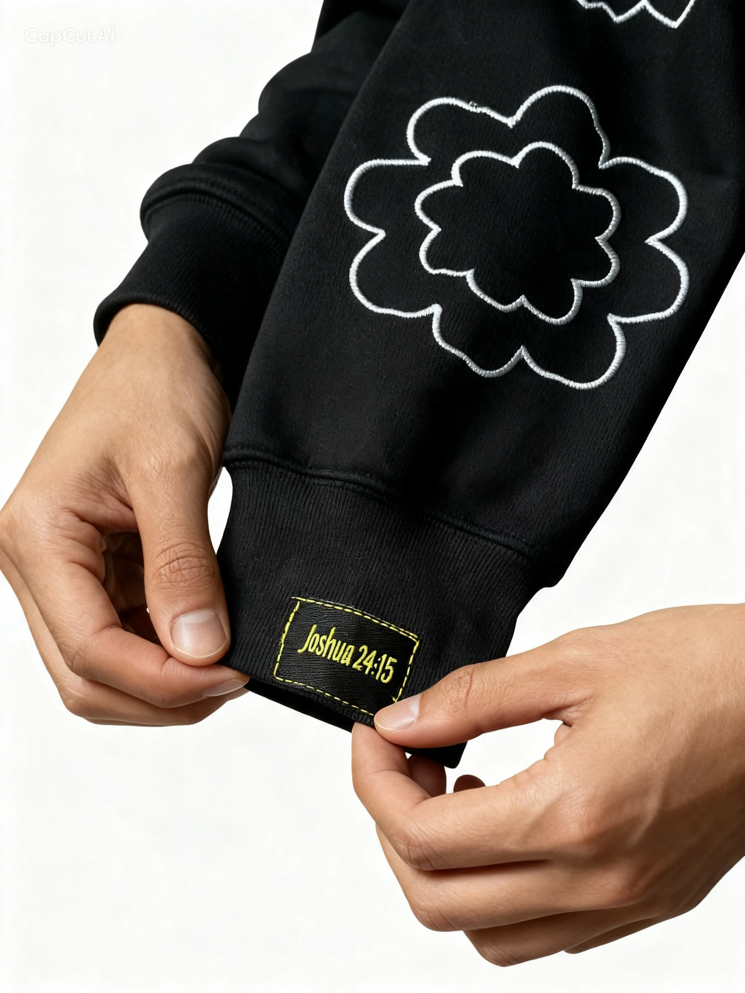 Close-up of the gold Joshua 24:15 cuff patch and white flower embroidery